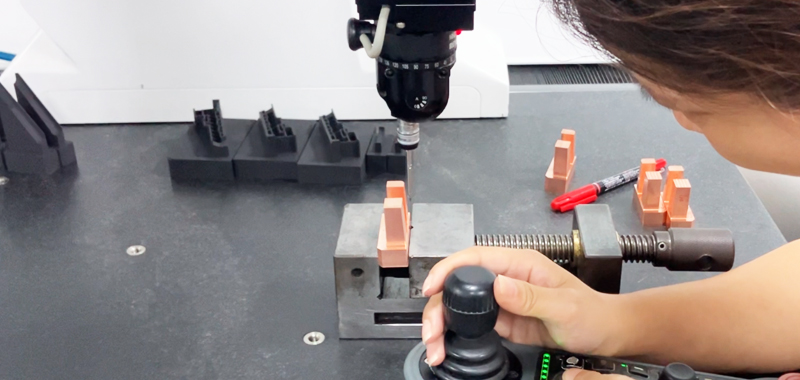 CROMA coordinate measuring machine inspecting a precision mold component with PC-DMIS software showing dimensional data
